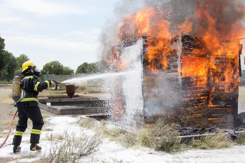 firefighter tackling a blaze